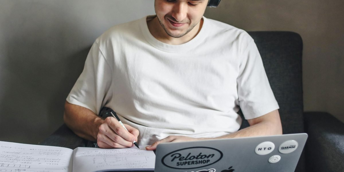 A person finds a comfortable and flexible setting to engage with their online studies.