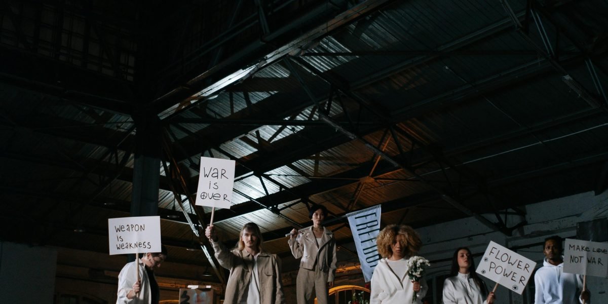 Individuals expressing discontent or resistance, symbolizing the historical worker pushback against rigid industrial systems.